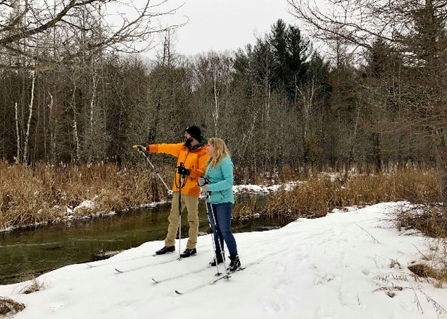 couple cross country skiing in walloon lake michigan